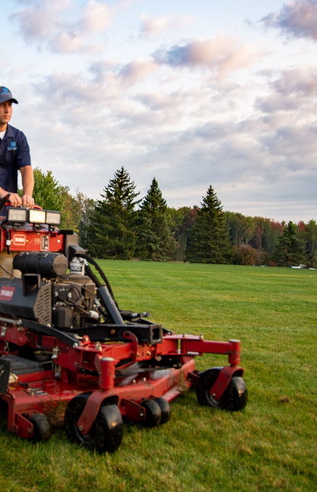 Man Mowing the Large Yard